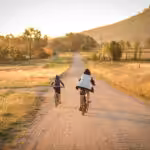 children riding bikes remote country lane