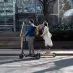 full shot people with electric transport city