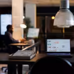 laptop computer with marketing statistics standing desk